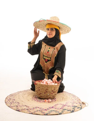 Saudi Woman in Traditional Asir Dress with Roses