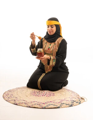 Emirati Woman in Traditional Dress with Honey Jar Studio