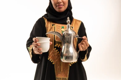 Emirati Woman Holding Traditional Dallah and Coffee Cups
