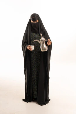 Saudi Woman in Traditional Abaya and Niqab with Dallah