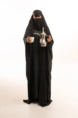 Saudi Woman in Abaya and Niqab Holding Coffee Dallah