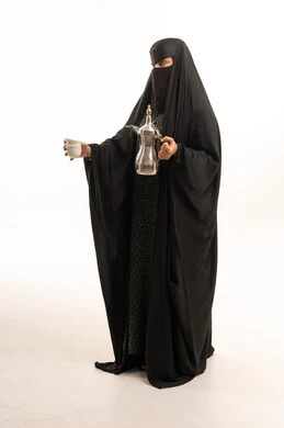 Saudi Woman with Traditional Arabic Coffee Dallah
