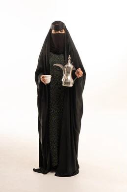Saudi Woman in Niqab Holding Traditional Arabic Coffee Pot