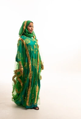 Saudi Woman in Traditional Green Nashal Dress