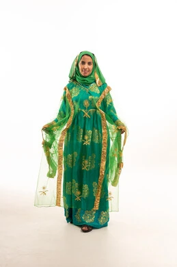 Saudi Woman in Traditional Green Nashal Dress Portrait