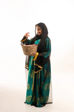 Emirati Girl in Traditional Green Nashl Dress