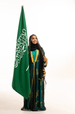 Saudi Woman with National Flag in Traditional Dress