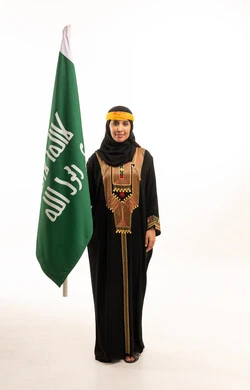 Saudi Woman with Saudi Flag in Traditional Abaya