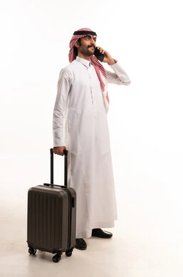 Saudi Man with Suitcase and Smartphone White Background