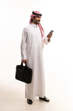 Saudi Businessman with Smartphone and Laptop Bag