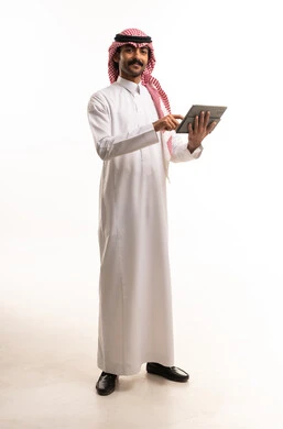 Saudi Man with Digital Tablet in Traditional Dress