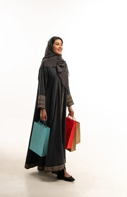 Saudi Woman in Abaya with Shopping Bags