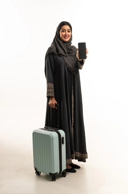 Saudi Woman with Suitcase Holding Smartphone Screen