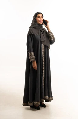 Saudi Woman in Abaya Talking on Smartphone in Studio