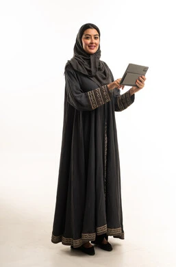 Saudi Woman in Black Abaya Using Digital Tablet Studio