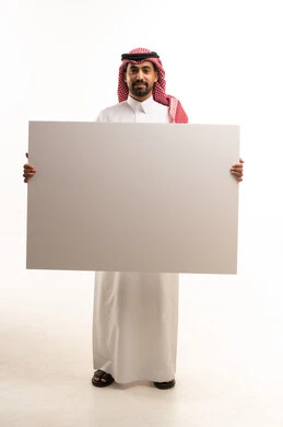 Saudi Man in Traditional Dress Holding Blank White Board