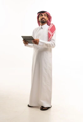 Saudi Man in Traditional Thobe Holding Tablet on White