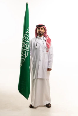 Saudi Doctor Holding National Flag on White Background