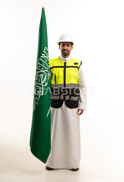 Saudi Engineer Wearing Safety Gear Holding National Flag