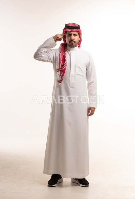 Saudi Man in Traditional Thobe Making Thinking Gesture