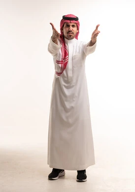 Saudi Man in Traditional Dress Gesturing in Studio