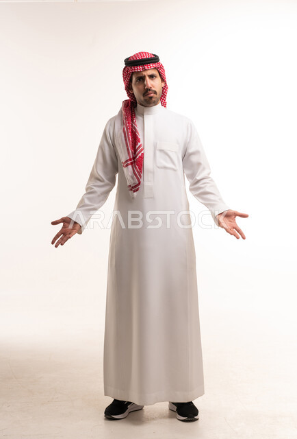Saudi Man in Thobe with Questioning Gesture