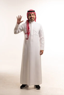Saudi Man in Traditional Thobe Waving in Studio