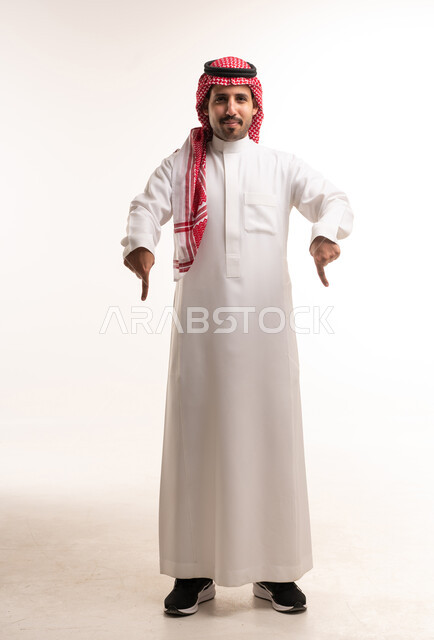 Saudi Man Pointing Down on White Background