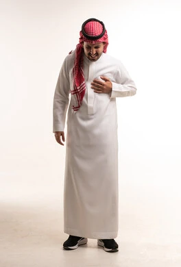 Saudi Man in Thobe Holding Chest with Pain