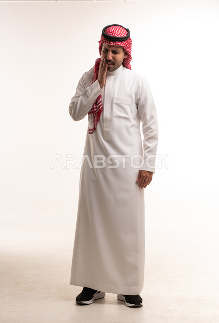 Saudi Man in Thobe Experiencing Toothache Pain