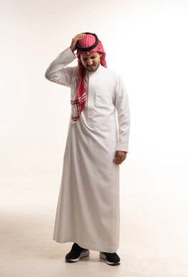Stressed Saudi Man with Headache in Traditional Thobe