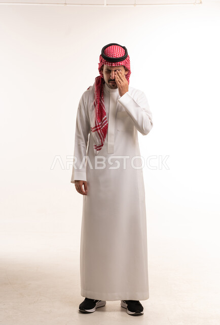 Saudi Man in Traditional Thobe Rubbing Eye Studio