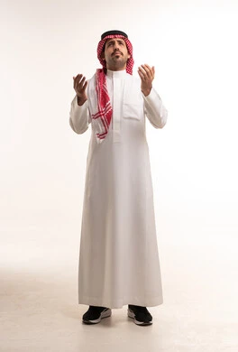 Saudi Man in Traditional Thobe Praying on White Background