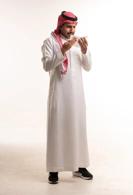 Saudi Man with Tissue in Traditional Dress