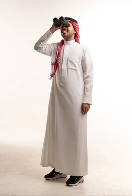 Saudi Man in Thobe Looking Through Binoculars