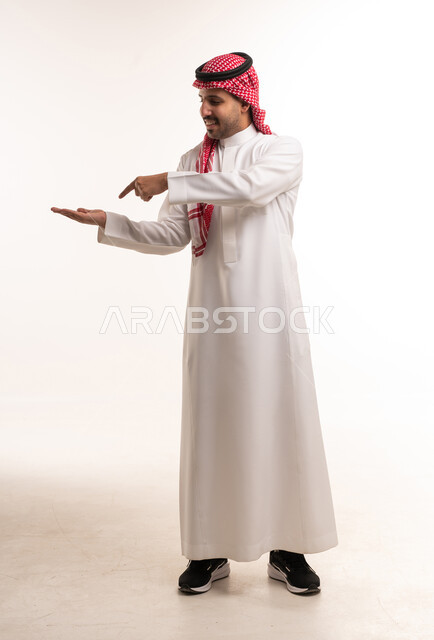 Saudi Man Presenting on White Background Studio Shot