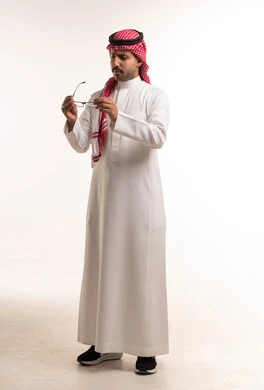Saudi Man in Traditional Thobe Holding Eyeglasses