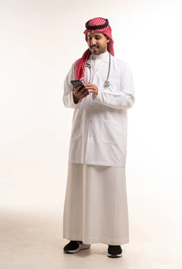 Saudi Male Doctor Using Smartphone in Lab Coat