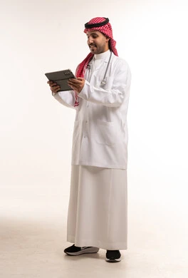Saudi Male Doctor Using Digital Tablet in Studio