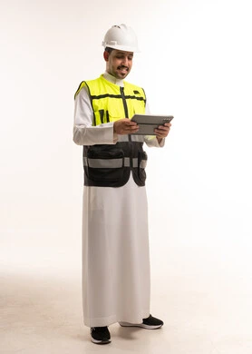 Saudi Engineer in Thobe with Tablet and Safety Gear