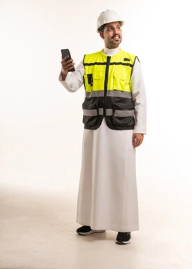 Saudi Engineer in Safety Vest Holding Smartphone