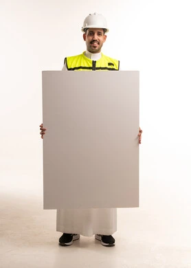 Saudi Engineer in Safety Vest Holding Blank Placard