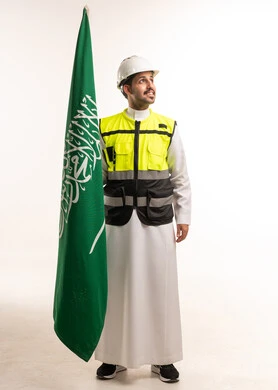 Saudi Engineer Holding National Flag on White Background