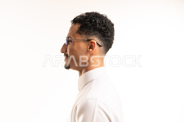 Saudi Man in White Thobe Wearing Eyeglasses Side View