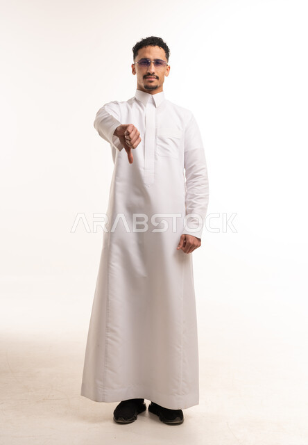 Saudi Man in White Thobe Thumbs Down Gesture
