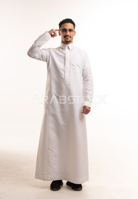 Saudi Man in White Thobe Pointing at Head Studio Shot