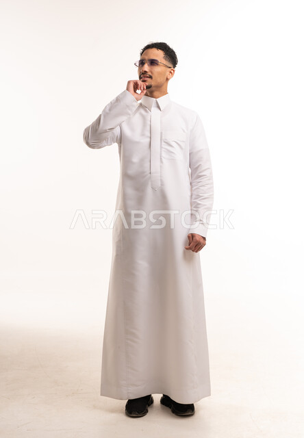 Saudi Man Wearing White Thobe Thinking on White Background