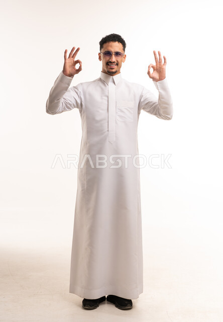 Saudi Man in White Thobe Making OK Gesture