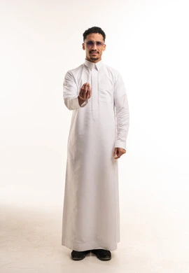 Saudi Man in White Thobe Making Questioning Gesture