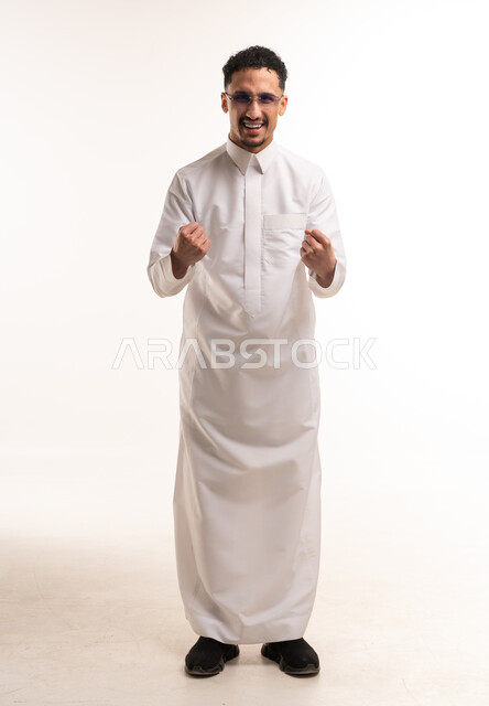 Saudi Man in White Thobe Celebrating Success Studio Shot